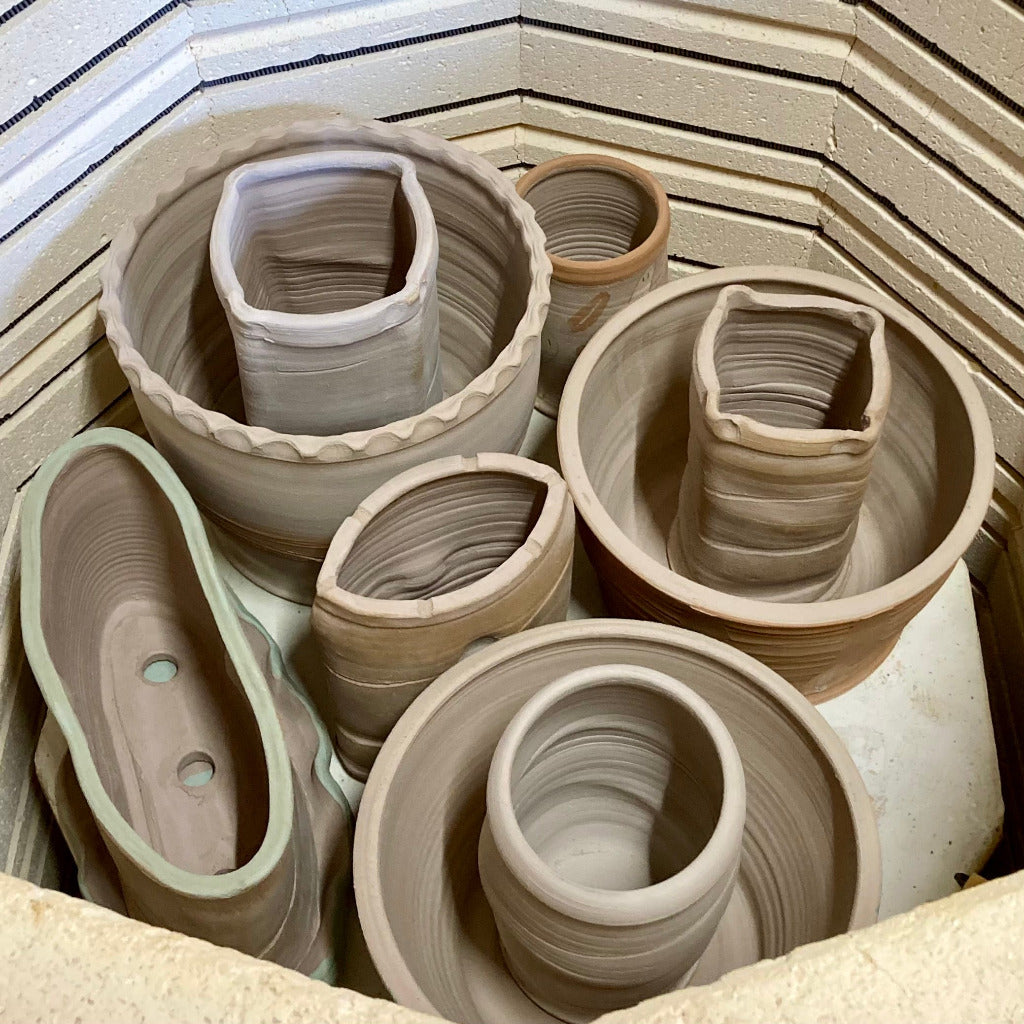 Pots inside an electric bisque kiln