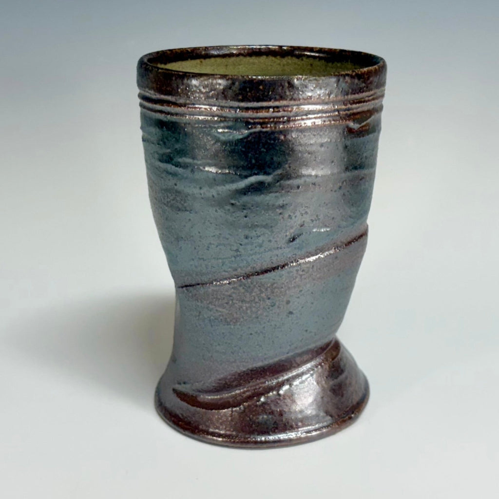 Handcrafted wood-fired ceramic cup with green-dark brown exterior and celadon green interior, made in Danbury, NC.