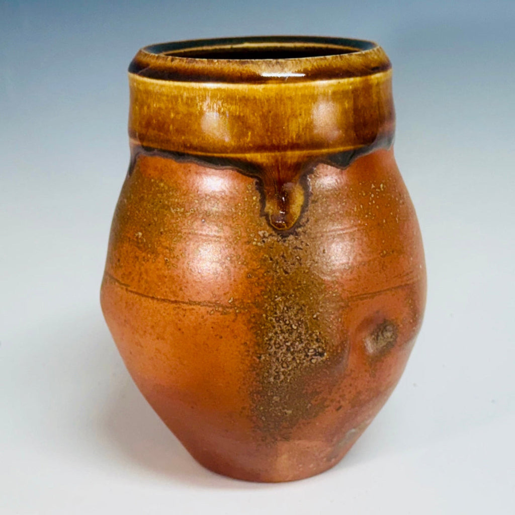Rustic small vase with amber glaze on speckled terracotta clay, handmade and wood-fired in Danbury, NC.