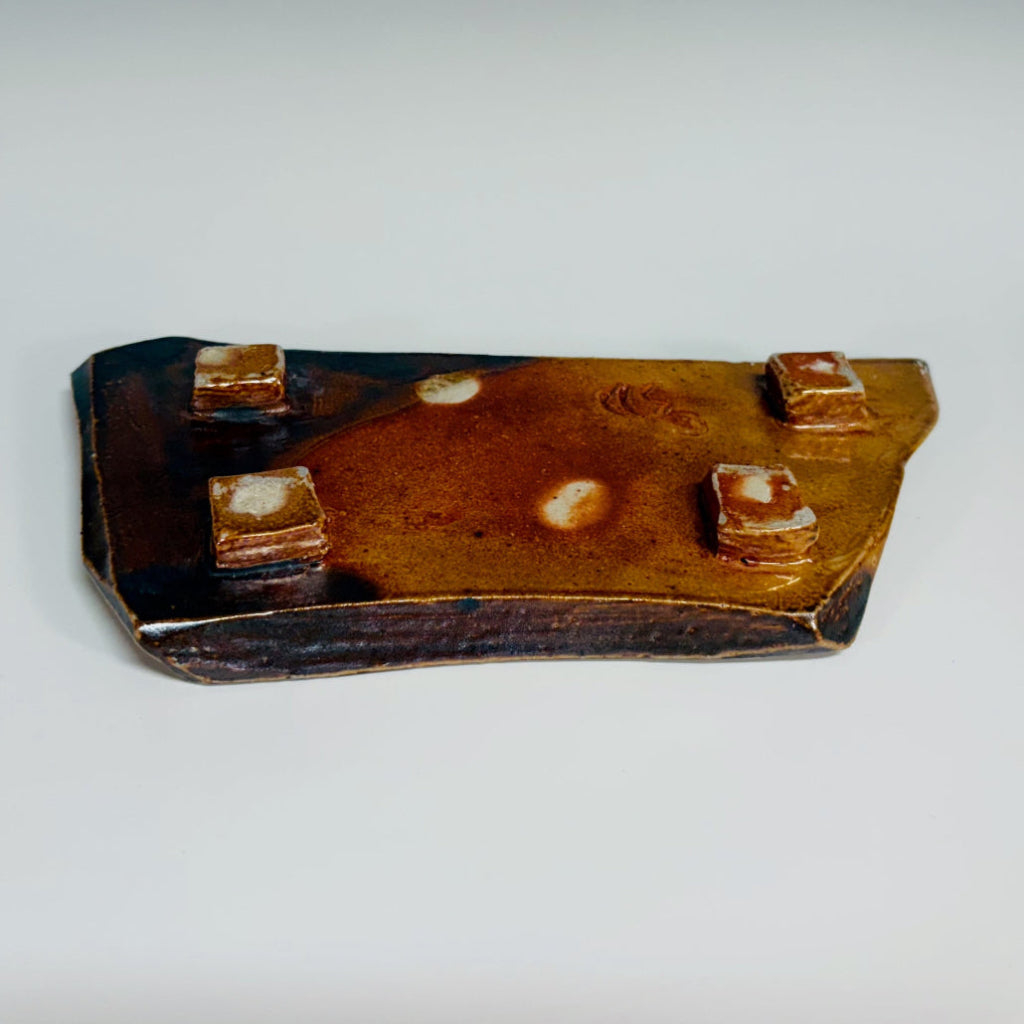 Handcrafted elongated soap dish with carved pattern and vibrant blue accents on brown stoneware, wood-fired in Danbury, NC.