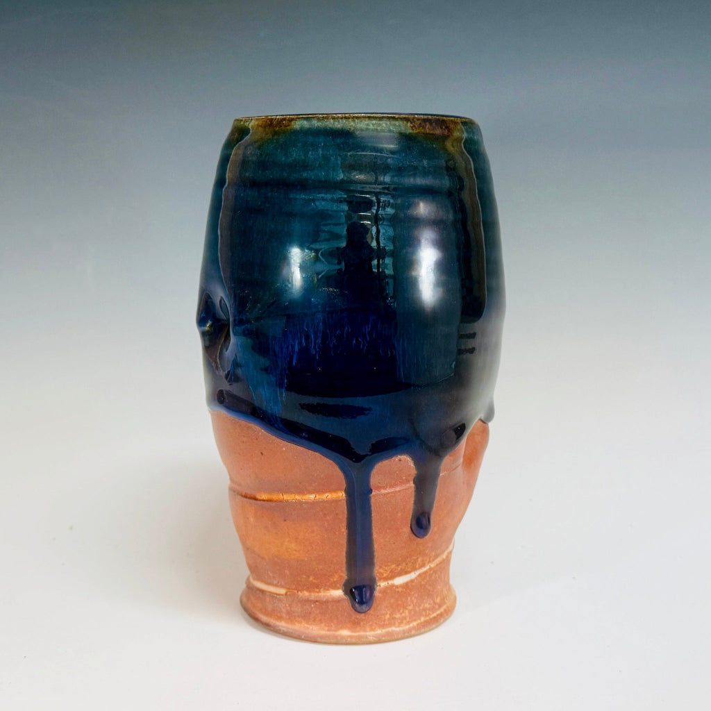 Handcrafted medium vase with cascading blue glaze over terracotta clay body, wood-fired in Danbury, NC.