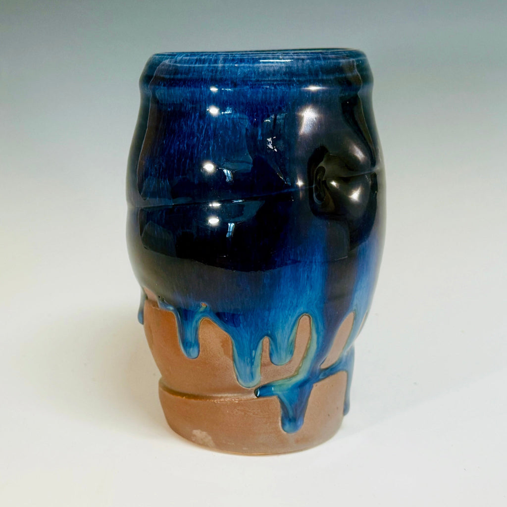  Bottom view: Artisan medium vase with deep blue glaze flowing over flashing slip, handmade and wood-fired in Danbury, NC