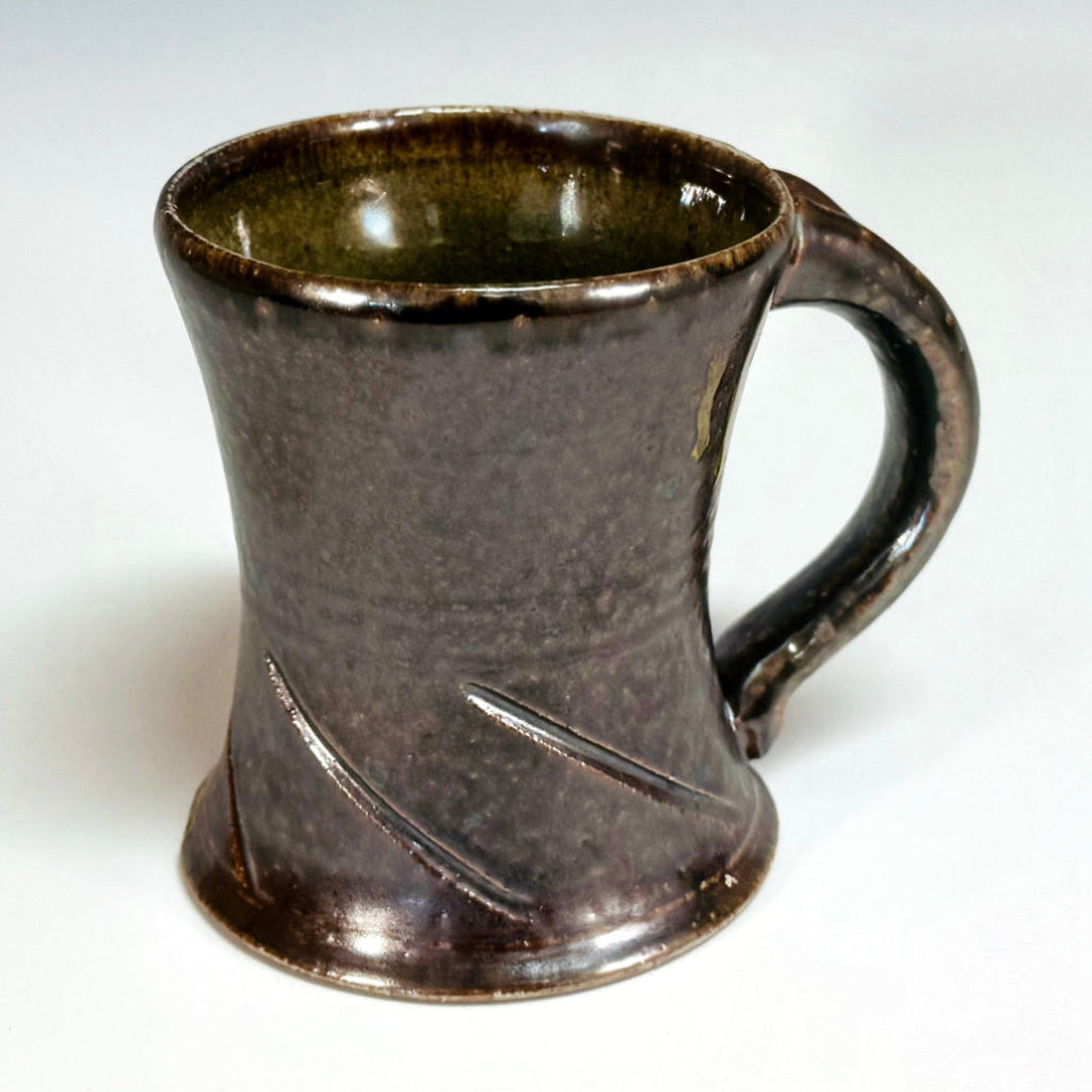 Handcrafted wood-fired ceramic mug with brown finish made in North Carolina.