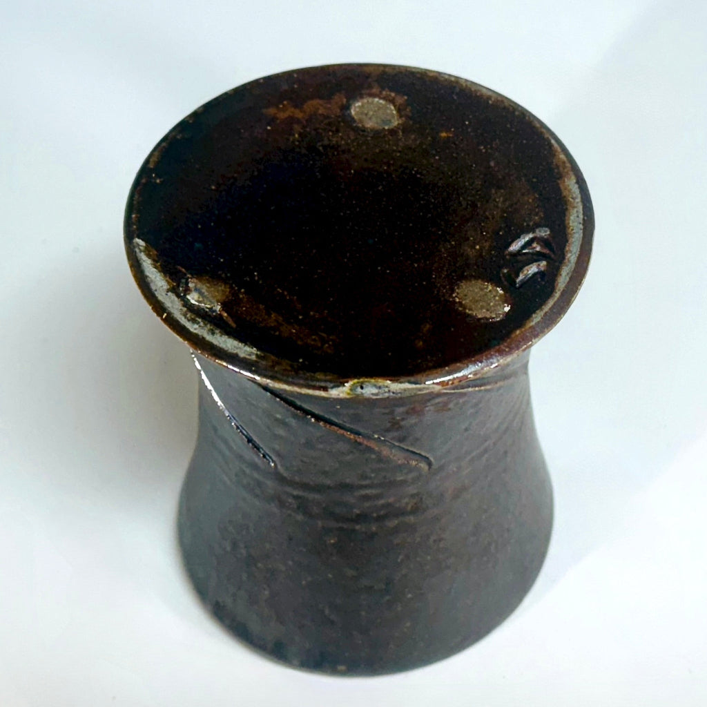 Bottom view of handcrafted wood-fired ceramic mug with brown finish made in North Carolina.