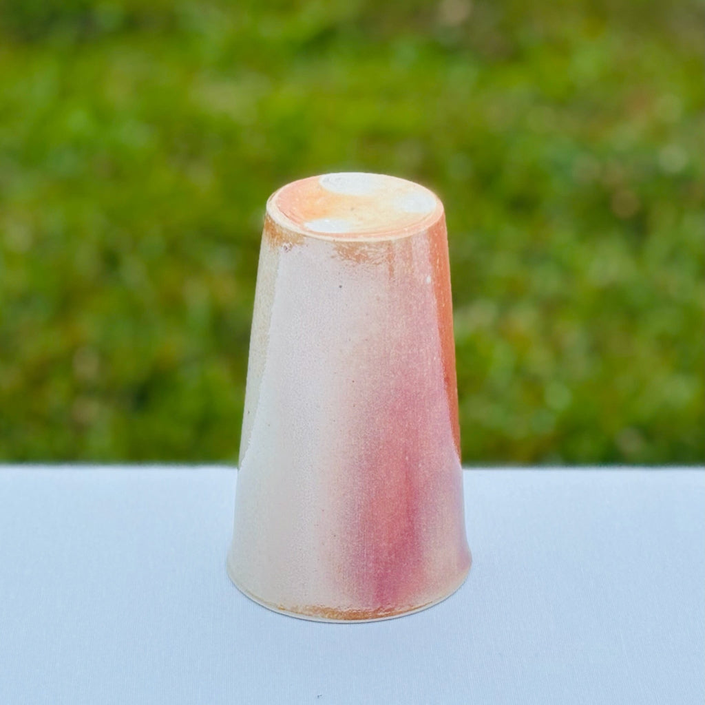 Sam Dougherty handcrafted porcelain cup  with pink/white gradient finish and a natural clay bottom with white wadding marks