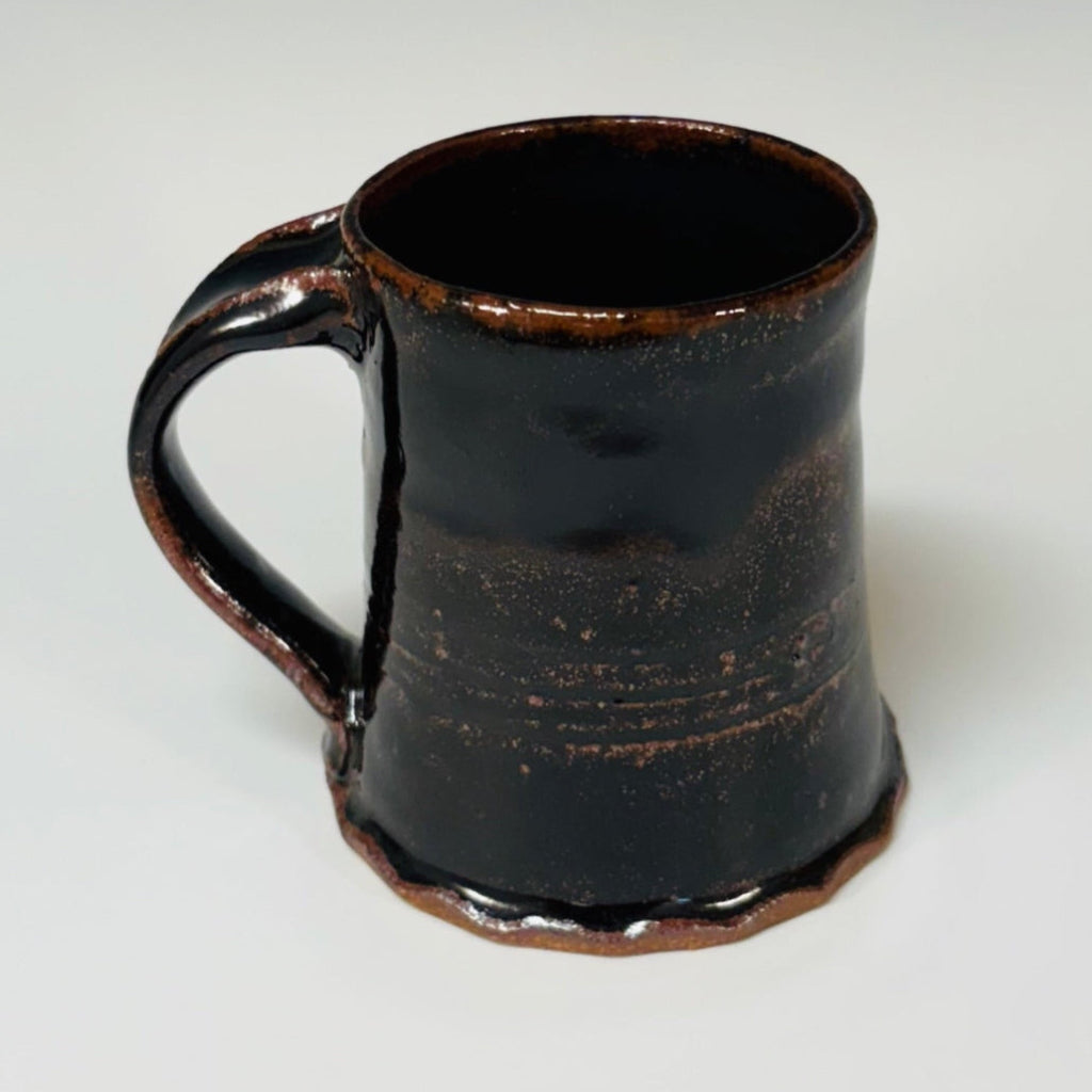 Handcrafted rustic Tenmoku ceramic coffee mug with brown rim accent and curved handle