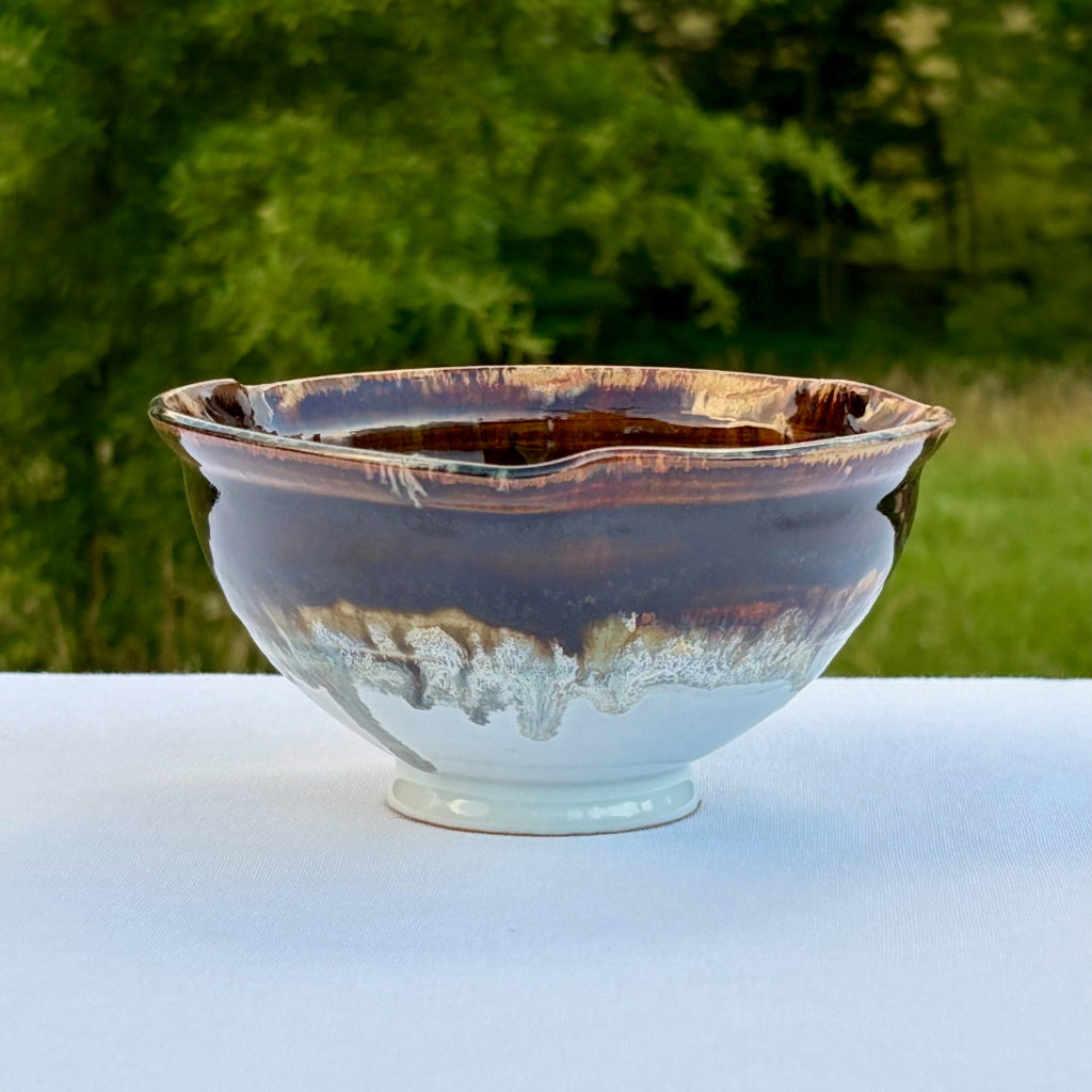 Handmade ceramic waterfall bowl showing white, titanium and brown cascade glaze effect